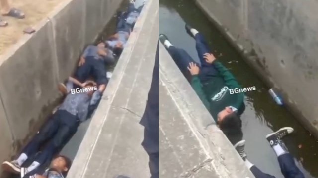 Kumpulan pelajar SMP dihukum berbaring di selokan oleh petugas keamanan gegara balap liar. (Foto: Instagram @mood.jakarta)