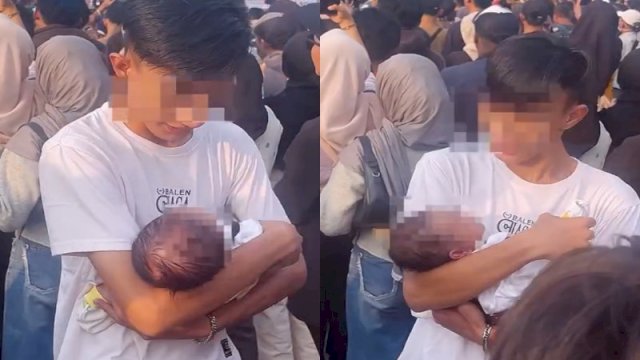 Seorang pria asyik nonton konser sambil menggendong bayi. (Foto: Instagram @fakta.indo)