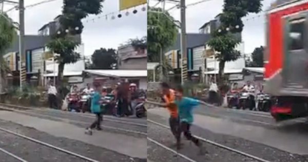 Bocah Nekat Berlari di Perlintasan Kereta Api dan Nyaris Tertabrak 